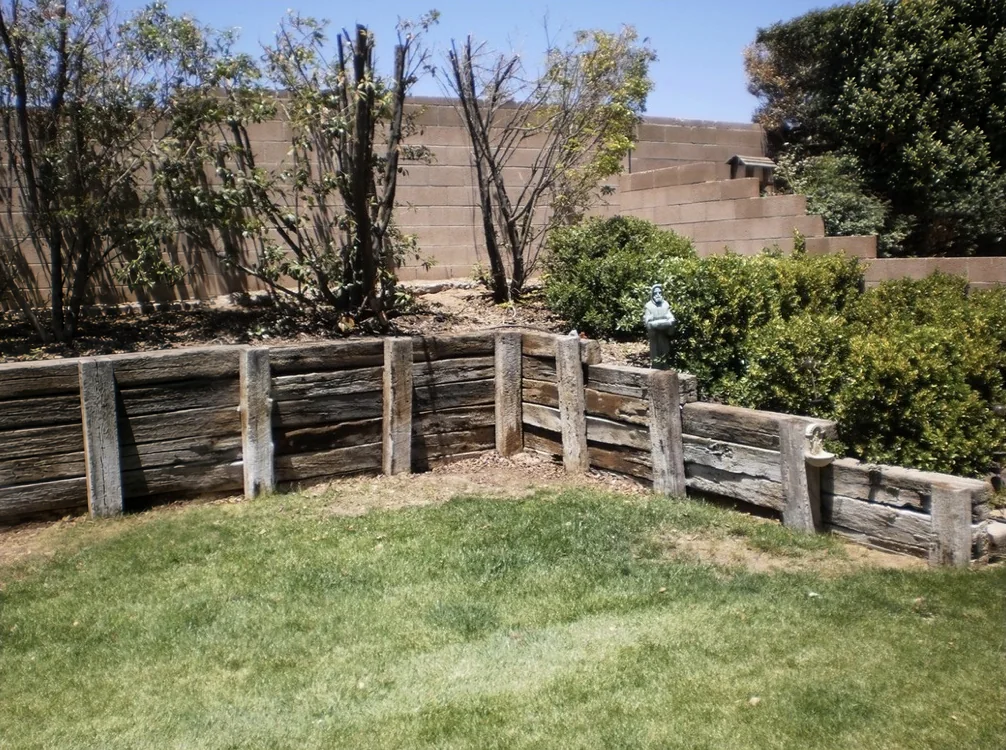 Terraced railroad-tie retaining wall with planted beds