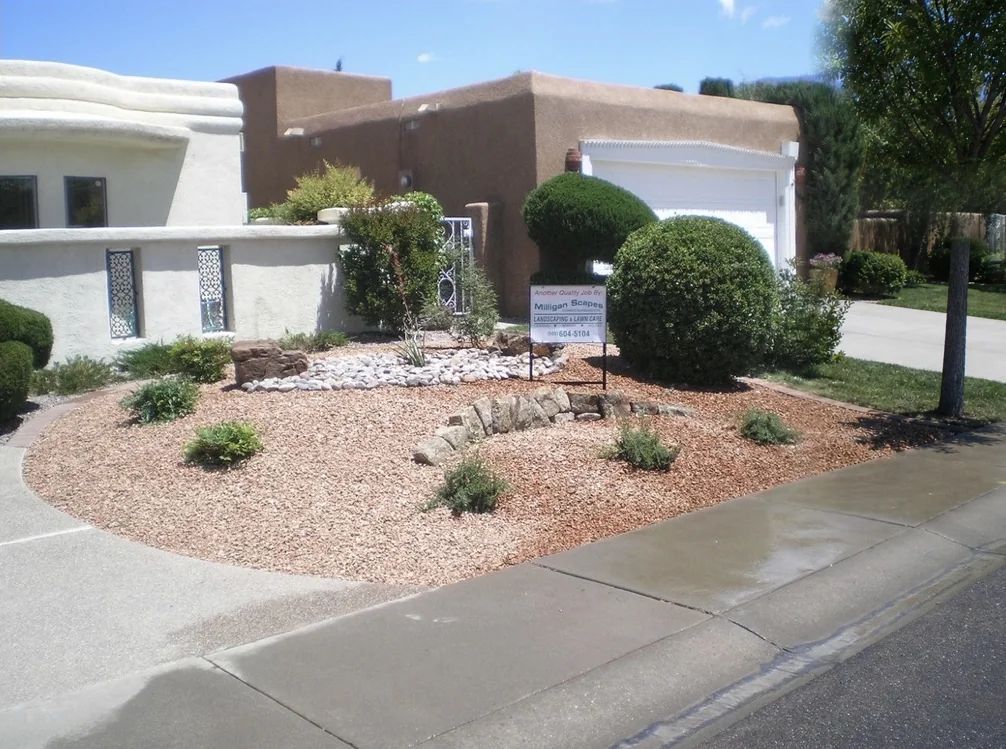 Xeriscape front yard with Milligan Scapes job sign in Albuquerque